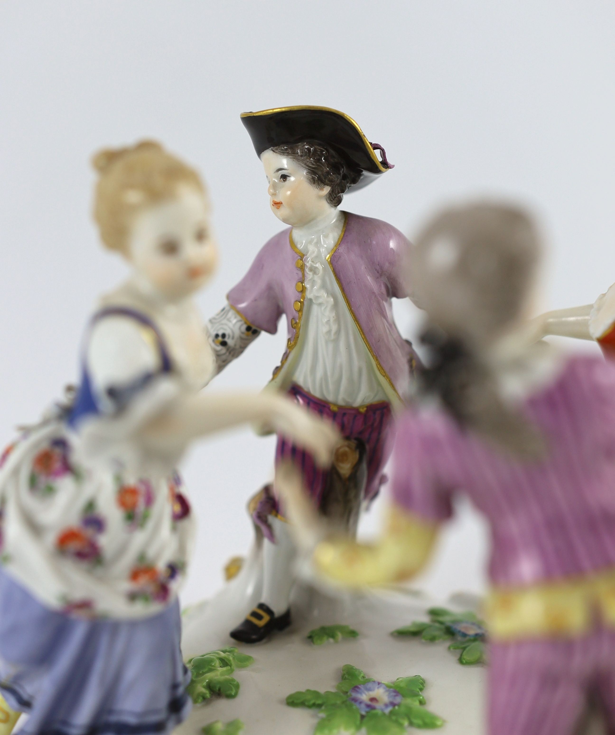 A Meissen group of four dancing children, early 20th century, 15 cm high